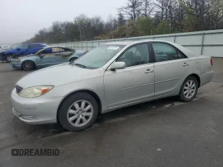 2002 Toyota Camry XLE z VIN JTDBF30K420017574, wystawiony jako Copart lot #55819275 z przebiegiem 164 710 mil mil oraz Czysty tytuł • Clean title. Historia ofert i sprzedaży dostępna na DreamBid. Obrazek 1.