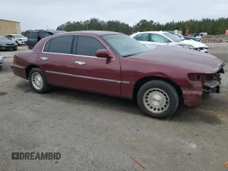 1999 Lincoln Town Car Executive z VIN 1LNHM81W5XY655075, wystawiony jako Copart lot #43263935 z przebiegiem Nie podano mil oraz Szkoda całkowita • Salvage title. Historia ofert i sprzedaży dostępna na DreamBid. Obrazek 4.