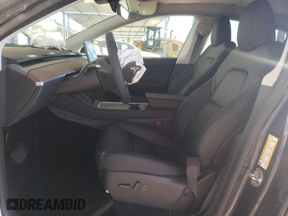 2024 Tesla Model Y Long Range with VIN 7SAYGDEE4RF127409, listed as a Copart auction lot 84274794 with 14,246 mi miles and Salvage title. Bid and sale history available at DreamBid. Image 7.