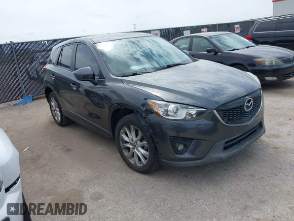 2014 Mazda CX-5 Grand Touring with VIN JM3KE2DY0E0354220, listed as a IAAI auction lot 41885502 with 168,901 mi miles. Bid and sale history available at carsss.com. Image 1.