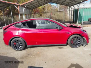 2023 Tesla Model Y Performance with VIN 7SAYGDEF6PF870935, listed as a IAAI auction lot 40718563 with 15,286 mi miles and . Bid and sale history available at DreamBid. Image 13.