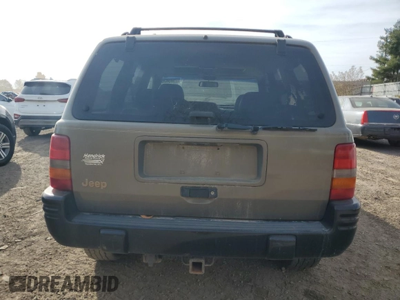 1998 Jeep Grand Cherokee Laredo with VIN 1J4GZ48YXWC299827, listed as a Copart auction lot 76898264 with 232,656 mi miles and Clean Title. Bid and sale history available at carsss.com. Image 6.