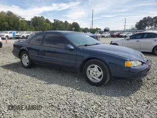 1996 Ford Thunderbird LX z VIN 1FALP62WXTH177910, wystawiony jako Copart lot #70954694 z przebiegiem 86 316 mil mil oraz Szkoda całkowita • Salvage title. Historia ofert i sprzedaży dostępna na DreamBid. Obrazek 4.