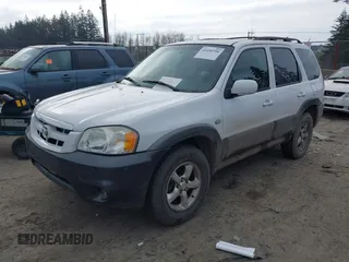 2005 Mazda Tribute LX with VIN 4F2CZ94105KM25420, listed as a IAAI auction lot 41450750 with 148,736 mi miles. Bid and sale history available at carsss.com. Image 2.