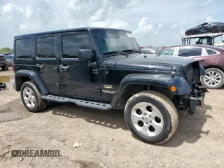 2015 Jeep Wrangler Unlimited Sahara with VIN 1C4BJWEG4FL668339, listed as a Copart auction lot 61221325 with 117,887 mi miles and Salvage title. Bid and sale history available at DreamBid. Image 4.