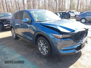 2020 Mazda CX-5 Grand Touring with VIN JM3KFBDM9L0756826, listed as a IAAI auction lot 41866290 with 145,567 mi miles. Bid and sale history available at carsss.com. Image 1.