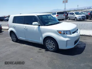 2014 Scion xB with VIN JTLZE4FE8EJ060455, listed as a IAAI auction lot 42114398 with 1 mi miles. Bid and sale history available at carsss.com. Image 1.
