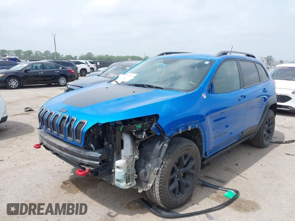 2018 Jeep Cherokee Trailhawk with VIN 1C4PJMBX6JD569684, listed as a IAAI auction lot 41925325 with 149,446 mi miles and . Bid and sale history available at DreamBid. Image 2.
