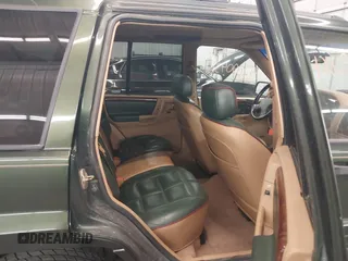 1997 Jeep Grand Cherokee Limited with VIN 1J4GZ78Y0VC684023, listed as a IAAI auction lot 42090436 with 310,831 mi miles. Bid and sale history available at carsss.com. Image 8.