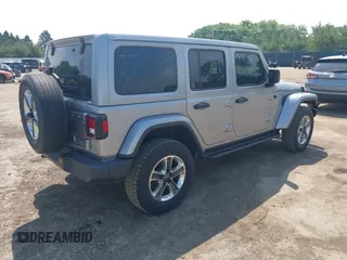 2019 Jeep Wrangler Unlimited Sahara with VIN 1C4HJXEN5KW542403, listed as a IAAI auction lot 42524989 with 60,451 mi miles and . Bid and sale history available at DreamBid. Image 4.