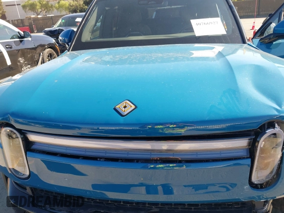 2025 Rivian R1S Adventure with VIN 7PDSGBBA9SN056202, listed as a IAAI auction lot 40766927 with 1,688 mi miles. Bid and sale history available at carsss.com. Image 10.