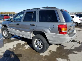 1999 Jeep Grand Cherokee Laredo with VIN 1J4GW58NXXC776438, listed as a Copart auction lot 84412044 with 163,060 mi miles and Salvage title. Bid and sale history available at DreamBid. Image 2.