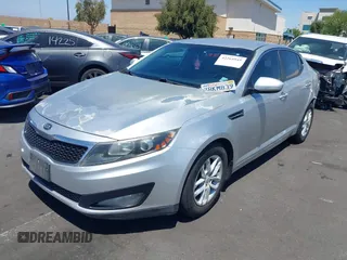 2013 Kia Optima LX z VIN KNAGM4A7XD5389662, wystawiony jako IAAI lot #42265945 z przebiegiem 164 488 mil mil oraz . Historia ofert i sprzedaży dostępna na DreamBid. Obrazek 2.