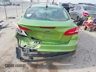 2018 Ford Focus SE z VIN 1FADP3FE5JL222542, wystawiony jako IAAI lot #42265608 z przebiegiem 107 397 mil mil oraz . Historia ofert i sprzedaży dostępna na DreamBid. Obrazek 16.