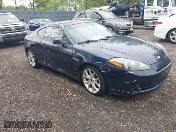 2008 Hyundai Tiburon GT z VIN KMHHN66F98U281833, wystawiony jako IAAI lot #42242717 z przebiegiem 123 291 mil mil oraz . Historia ofert i sprzedaży dostępna na DreamBid. Obrazek 1.