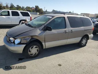 1999 Toyota Sienna LE with VIN 4T3ZF13C0XU169684, listed as a Copart auction lot 58590235 with 164,093 mi miles and Salvage title. Bid and sale history available at DreamBid. Image 1.