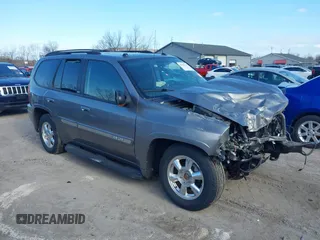 2005 GMC Envoy SLE with VIN 1GKDT13S852362380, listed as a IAAI auction lot 42031727 with 76,711 mi miles. Bid and sale history available at carsss.com. Image 1.