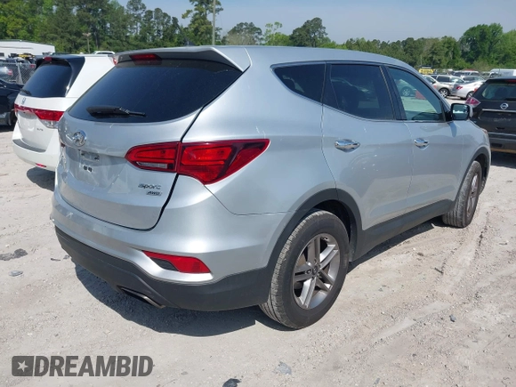 2018 Hyundai Santa Fe 2.4L z VIN 5XYZTDLB9JG513584, wystawiony jako IAAI lot #42031291 z przebiegiem 131 109 mil mil oraz . Historia ofert i sprzedaży dostępna na DreamBid. Obrazek 4.
