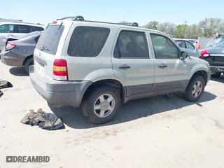 2003 Ford Escape XLS Popular with VIN 1FMYU02103KE20195, listed as a IAAI auction lot 41830663 with 262,580 mi miles. Bid and sale history available at carsss.com. Image 4.