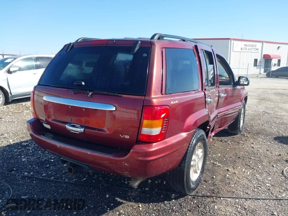 1999 Jeep Grand Cherokee Limited with VIN 1J4GW68N3XC770468, listed as a IAAI auction lot 41793600 with 65,277 mi miles. Bid and sale history available at carsss.com. Image 4.