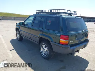 1995 Jeep Grand Cherokee Laredo with VIN 1J4GZ58Y2SC669152, listed as a IAAI auction lot 42077067 with 134,022 mi miles. Bid and sale history available at carsss.com. Image 3.