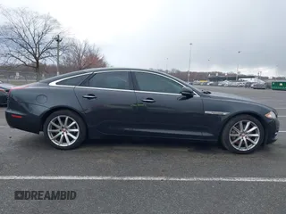 2014 Jaguar XJ with VIN SAJWA1CZ0E8V73966, listed as a IAAI auction lot 41887234 with 120,804 mi miles and . Bid and sale history available at DreamBid. Image 13.