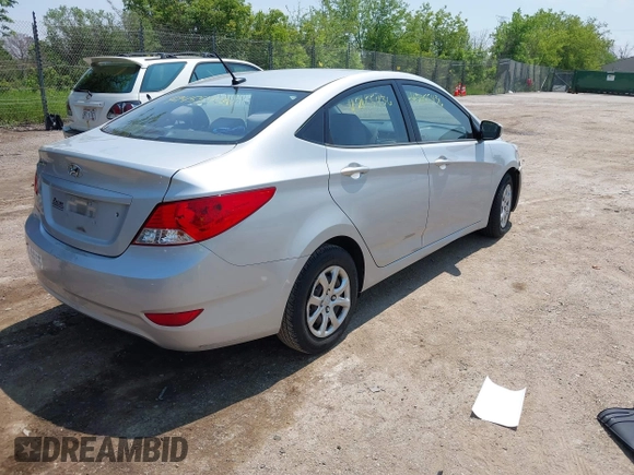 2014 Hyundai Accent GLS z VIN KMHCT4AE1EU637366, wystawiony jako IAAI lot #42455436 z przebiegiem 121 764 mil mil oraz . Historia ofert i sprzedaży dostępna na DreamBid. Obrazek 4.