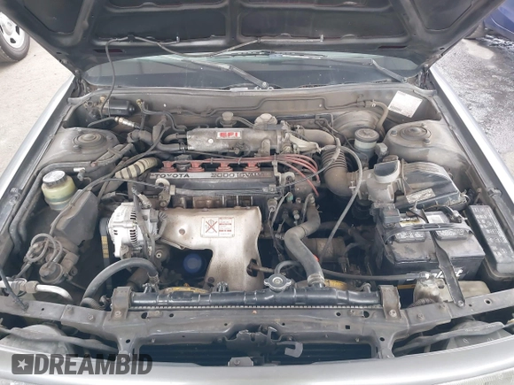 1990 Toyota Camry DLX z VIN 4T1SV21E7LU248206, wystawiony jako IAAI lot #41793635 z przebiegiem 83 550 mil mil oraz . Historia ofert i sprzedaży dostępna na DreamBid. Obrazek 10.
