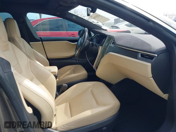 2015 Tesla Model S 85 with VIN 5YJSA1E14FF120455, listed as a IAAI auction lot 42053306 with 62,817 mi miles and . Bid and sale history available at DreamBid. Image 5.