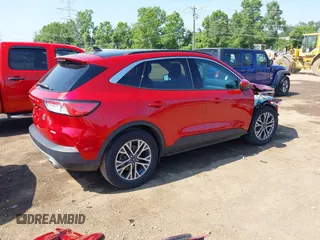 2020 Ford Escape SEL z VIN 1FMCU0H6XLUB62303, wystawiony jako IAAI lot #42646790 z przebiegiem 70 895 mil mil oraz . Historia ofert i sprzedaży dostępna na DreamBid. Obrazek 4.