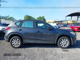 2014 Mazda CX-5 Sport with VIN JM3KE2BE8E0313407, listed as a IAAI auction lot 41215428 with 120,387 mi miles and . Bid and sale history available at carsss.com. Image 13.