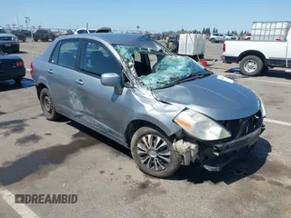 2009 Nissan Versa 1.8 S with VIN 3N1BC11E09L449780, listed as a IAAI auction lot 42034977 with 180,680 mi miles. Bid and sale history available at carsss.com. Image 1.