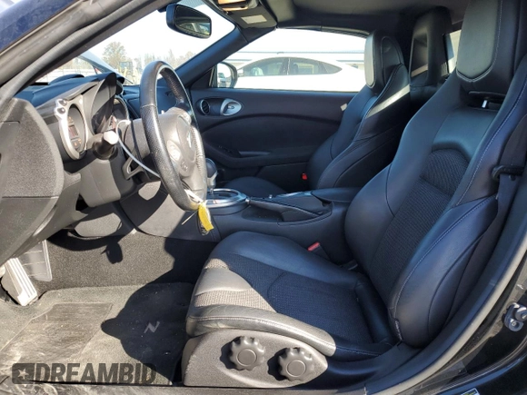 2014 Nissan 370Z Touring with VIN JN1AZ4FH3EM620195, listed as a Copart auction lot 83207104 with 66,974 mi miles and Salvage Title. Bid and sale history available at DreamBid. Image 7.