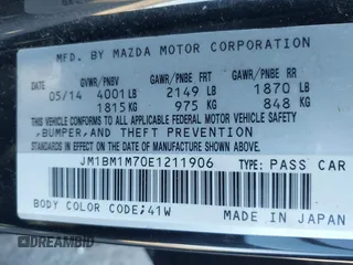 2014 Mazda 3 i Grand Touring with VIN JM1BM1M70E1211906, listed as a IAAI auction lot 41878585 with 112,013 mi miles and . Bid and sale history available at DreamBid. Image 9.