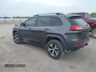2015 Jeep Cherokee Trailhawk with VIN 1C4PJMBSXFW654754, listed as a IAAI auction lot 39935278 with 128,076 mi miles and . Bid and sale history available at DreamBid. Image 3.