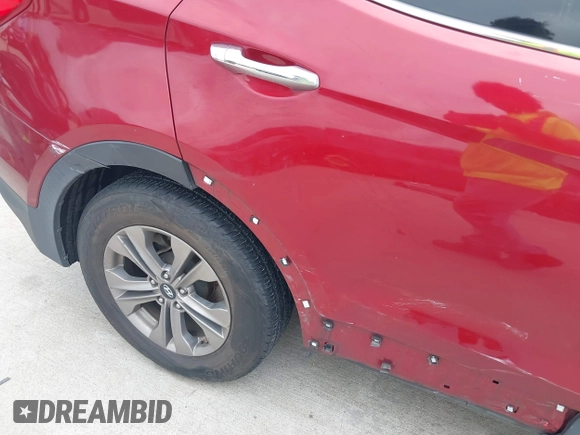 2016 Hyundai Santa Fe z VIN 5XYZT3LB1GG321854, wystawiony jako IAAI lot #40244942 z przebiegiem Nie podano mil oraz . Historia ofert i sprzedaży dostępna na DreamBid. Obrazek 12.