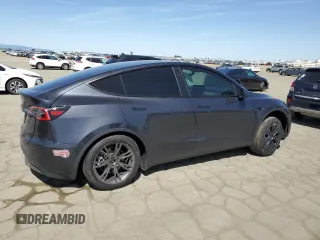 2025 Tesla Model Y Long Range with VIN 7SAYGDED4SF240354, listed as a Copart auction lot 52049745 with 6,785 mi miles and Salvage Title. Bid and sale history available at DreamBid. Image 3.