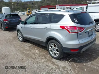 2016 Ford Escape Titanium with VIN 1FMCU9JX3GUA62802, listed as a IAAI auction lot 42001690 with 124,452 mi miles. Bid and sale history available at carsss.com. Image 3.