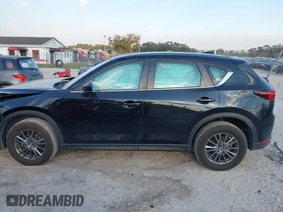 2019 Mazda CX-5 Sport with VIN JM3KFABMXK0693540, listed as a IAAI auction lot 41523569 with 57,895 mi miles and . Bid and sale history available at DreamBid. Image 14.