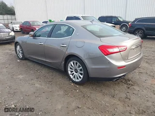 2014 Maserati Ghibli with VIN ZAM57XSA9E1082923, listed as a IAAI auction lot 41110273 with 91,551 mi miles. Bid and sale history available at carsss.com. Image 3.