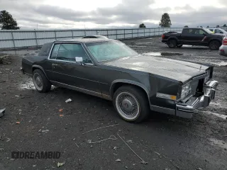 1984 Cadillac Eldorado z VIN 1G6AL5781EE619594, wystawiony jako Copart lot #80918934 z przebiegiem 47 529 mil mil oraz Szkody całkowita. Historia ofert i sprzedaży dostępna na DreamBid. Obrazek 4.