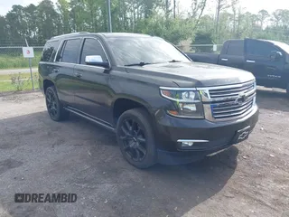 2015 Chevrolet Tahoe LTZ with VIN 1GNSCCKC5FR103676, listed as a IAAI auction lot 42456913 with 214,009 mi miles and . Bid and sale history available at DreamBid. Image 1.