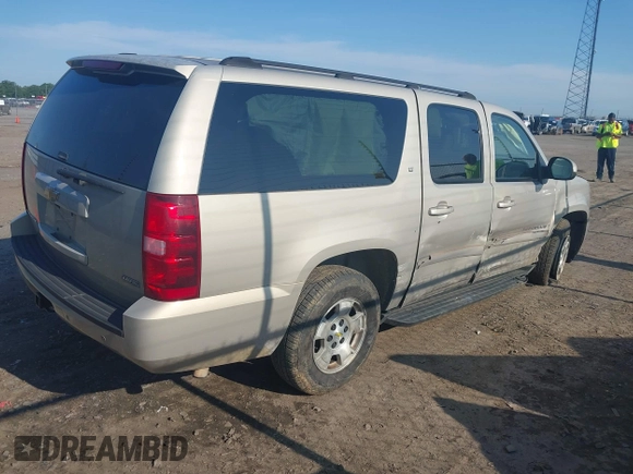 2007 Chevrolet Suburban LS with VIN 1GNFC16007J203853, listed as a IAAI auction lot 39454050 with 246,521 mi miles and . Bid and sale history available at DreamBid. Image 4.