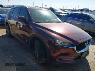 2019 Mazda CX-5 Sport with VIN JM3KFABM2K0686372, listed as a IAAI auction lot 41770183 with 57,202 mi miles and . Bid and sale history available at DreamBid. Image 1.