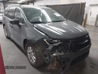 2022 Chrysler Pacifica Touring L with VIN 2C4RC1BGXNR235047, listed as a IAAI auction lot 42135562 with 64,241 mi miles and . Bid and sale history available at DreamBid. Image 1.