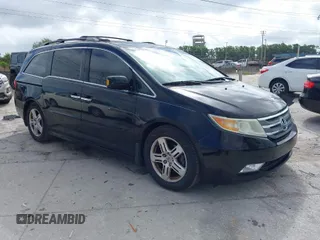 2013 Honda Odyssey Touring with VIN 5FNRL5H92DB003200, listed as a IAAI auction lot 41920237 with 167,483 mi miles and . Bid and sale history available at carsss.com. Image 1.