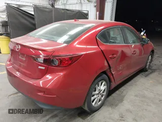 2015 Mazda Mazda3 i Touring with VIN 3MZBM1V70FM180723, listed as a IAAI auction lot 41879592 with 135,976 mi miles. Bid and sale history available at carsss.com. Image 4.