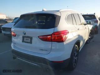 2019 BMW X1 sDrive28i with VIN WBXHU7C54K3H45462, listed as a IAAI auction lot 41209117 with 52,719 mi miles. Bid and sale history available at carsss.com. Image 4.