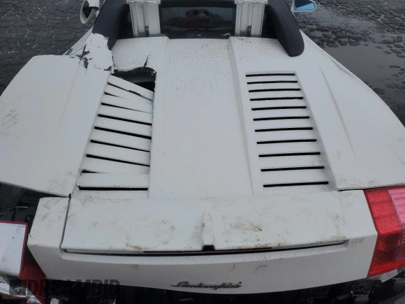2007 Lamborghini Gallardo z VIN ZHWGU22T77LA05172, wystawiony jako Copart lot #44416945 z przebiegiem Nie podano mil oraz Szkody całkowita. Historia ofert i sprzedaży dostępna na DreamBid. Obrazek 11.