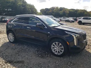 2023 Cadillac XT4 AWD Luxury with VIN 1GYFZBR49PF101377, listed as a Copart auction lot 73961294 with 26,847 mi miles and Salvage Title. Bid and sale history available at carsss.com. Image 4.